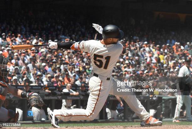 Mac Williamson of the San Francisco Giants bats against the Miami Marlins in the bottom of the six inning at AT&T Park on June 20, 2018 in San...