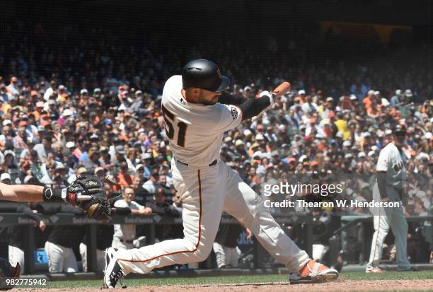 Mac Williamson of the San Francisco Giants bats against the Miami Marlins in the bottom of the six inning at AT&T Park on June 20, 2018 in San...