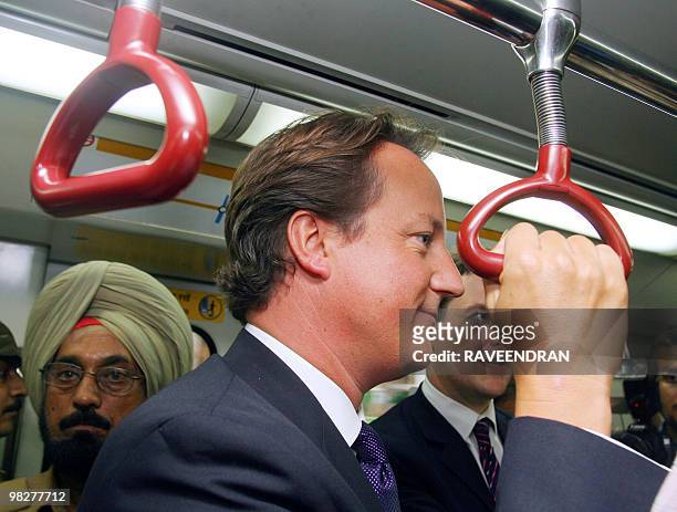 Leader of the Conservative Party in the United Kingdom, David Cameron , travels in the Delhi Metro during his visit in New Delhi, 06 September 2006....