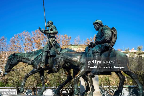 Bronze sculptures of Don Quixote and Sancho Panza at the Cervantes monument, Plaza de Espana, Madrid, Spain.