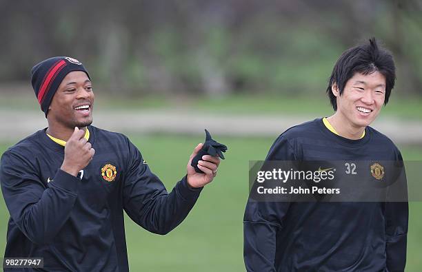 Patrice Evra and Ji-Sung Park of Manchester United in action during a First Team Training Session at Carrington Training Ground on April 6 2010 in...