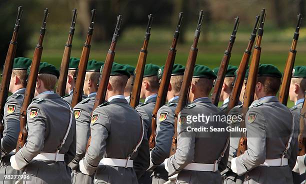 Soldiers of the German Bundeswehr depart after welcoming Albanian President Bamir Topi in an honour guard formation at Bellevue Palace on April 6,...
