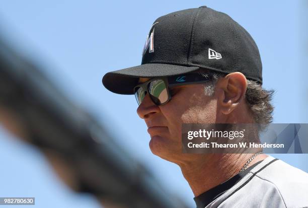 Manager Don Mattingly of the Miami Marlins looks on as he comes out of the dugout to make a pitching change against the San Francisco Giants in the...