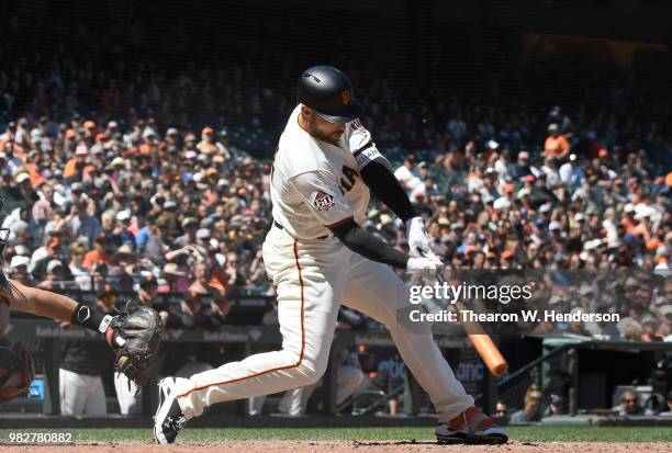 Mac Williamson of the San Francisco Giants bats against the Miami Marlins in the bottom of the eighth inning at AT&T Park on June 20, 2018 in San...