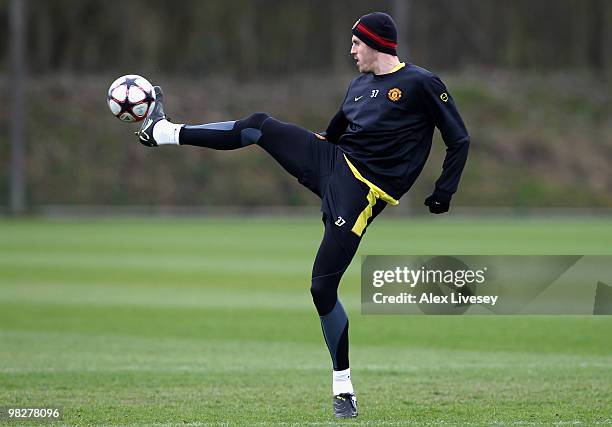 Michael Carrick of Manchester United controls the ball during a training session ahead of their Champions League match against Bayern Munich at the...