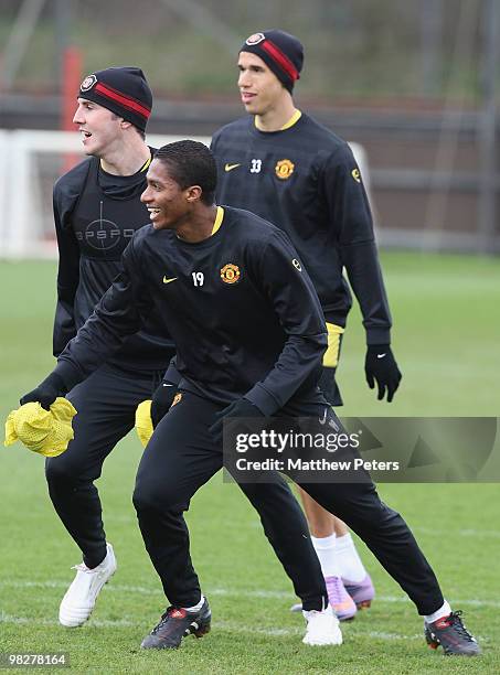 John O'Shea, Antonio Valencia and Gabriel Obertan of Manchester United in action during a First Team Training Session at Carrington Training Ground...