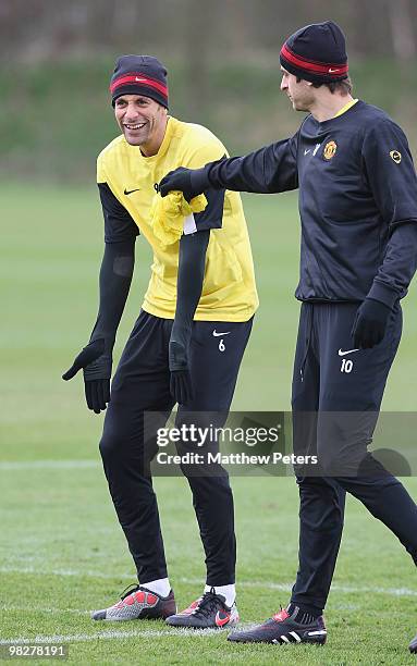 Rio Ferdinand and Dimitar Berbatov of Manchester United in action during a First Team Training Session at Carrington Training Ground on April 6 2010,...