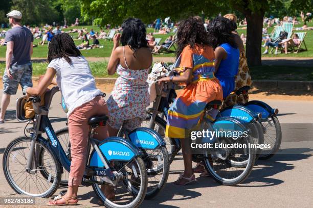 Cyclist using the London bicycles for hire. Seen in Hyde park, London, UK.