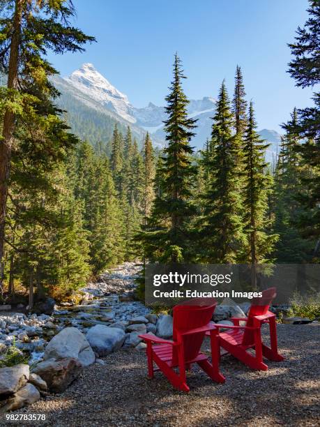 Red chairs at Glacier National Park near Golden. British Columbia. Canada.
