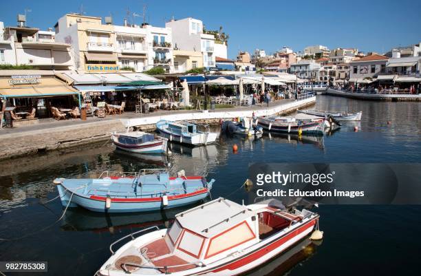 Agios Nicolaos, Crete, Greece. Boats and eating places on the Inner Lagoon.