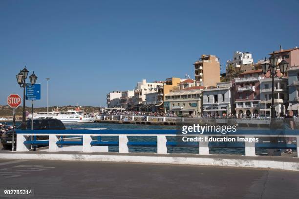 Agios Nicolaos, Crete, Greece. Boats and eating places on the harbor.