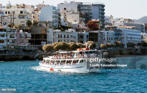 Agios Nikolaos, Crete, Greece. Cruise boat with passengers in the harbor.