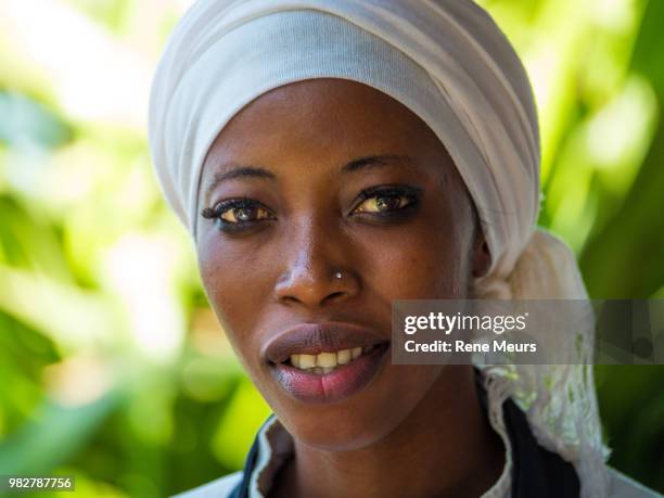 portrait of young woman in white bandana, banjul, fajara, gambia - banjul stock pictures, royalty-free photos & images