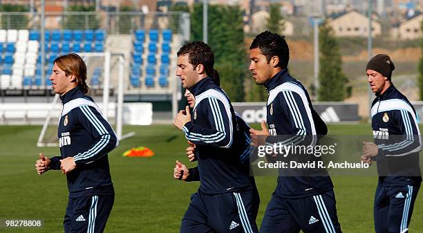 Sergio Ramos , Gonzalo Higuain , Ezequiel Garay and Guti run during a training session at Valdebebason April 6, 2010 in Madrid, Spain.