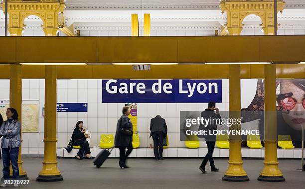 People wait for a metro on March 24, 2010 at the Gare de Lyon subway station in Paris. AFP PHOTO LOIC VENANCE