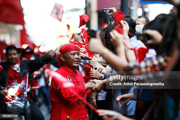 Thousands of Red shirt supporters of former PM Thaksin Shinawatra defy the government for a fourth day by taking over the streets of the city's main...