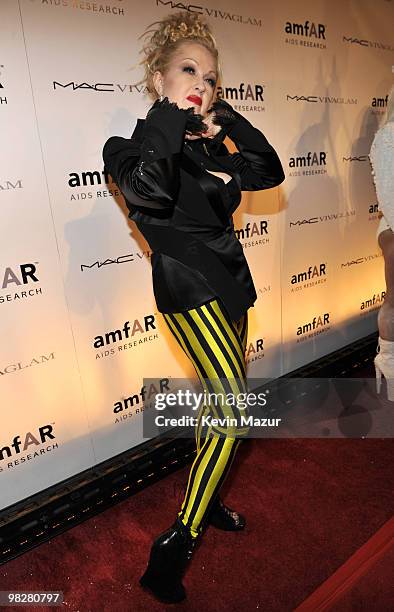 Viva Glam spokesperson Cyndi Lauper walk the red carpet at amfAR Gala at Cipriani 42nd Street on February 10, 2010 in New York City.