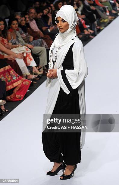 Pakistani model presents creation by Rabia during a Fashion Week in Karachi on April 5, 2010. Pakistan began a new fashion week with an opulent...