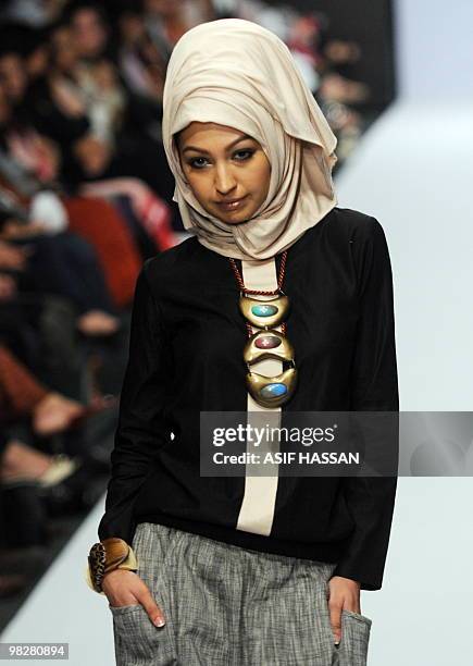 Pakistani model presents creation by Rabia during a Fashion Week in Karachi on April 5, 2010. Pakistan began a new fashion week with an opulent...