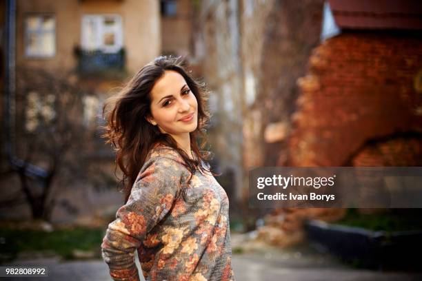 portrait of smiling woman in floral sweater, lviv, lviv oblast, ukraine - lviv oblast stock pictures, royalty-free photos & images