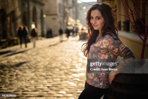 young woman posing in lviv old town street, lviv, lviv oblast, ukraine - lviv oblast stock pictures, royalty-free photos & images