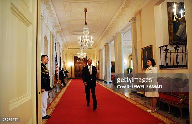 President Barack Obama arrives to host an Easter Prayer Breakfast in the East Room at the White House in Washington, DC, on April 6, 2010. AFP...