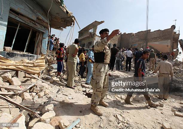 Iraqis gather at the site of a bombing on April 6, 2010 in Alawi area near Haifa street in Baghdad, Iraq. Six co-ordinated attacks claimed the lives...
