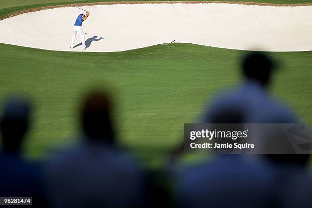 Dustin Johnson plays a bunker shot during a practice round prior to the 2010 Masters Tournament at Augusta National Golf Club on April 6, 2010 in...