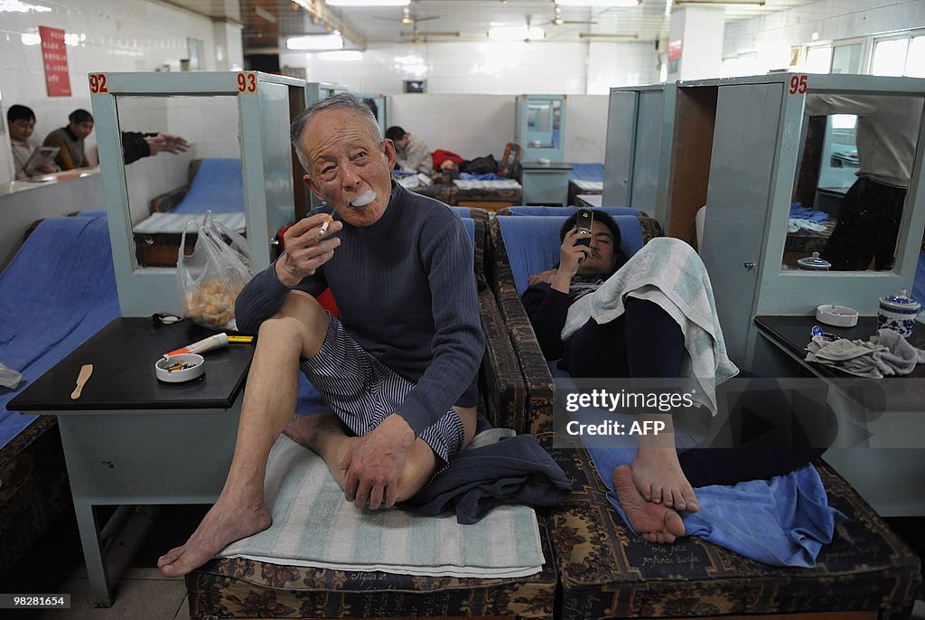 Chinese men relax at a traditional bathh
