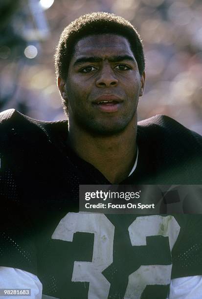 Running Back Marcus Allen of the Los Angeles Raiders watches the action from the sidelines circa mid 1980's during an NFL Football game at the Los...