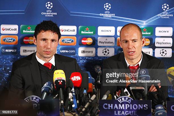 Mark van Bommel of Bayern Muenchen and Arjen Robben attend a press conference at the Marriott Worlsey Park hotel on April 6, 2010 in Manchester,...