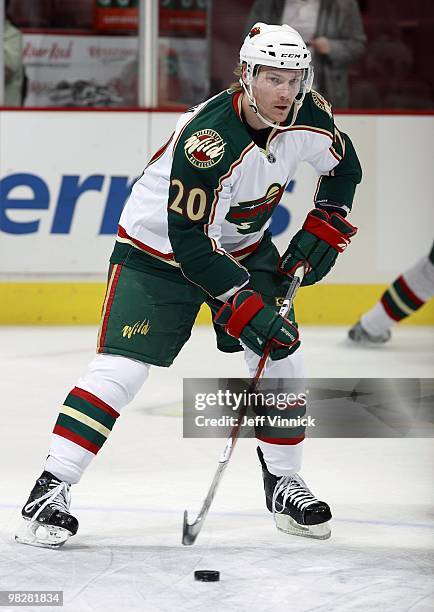 Antti Miettinen of the Minnesota Wild skates up ice with the puck during their game against the Vancouver Canucks at General Motors Place on April 4,...