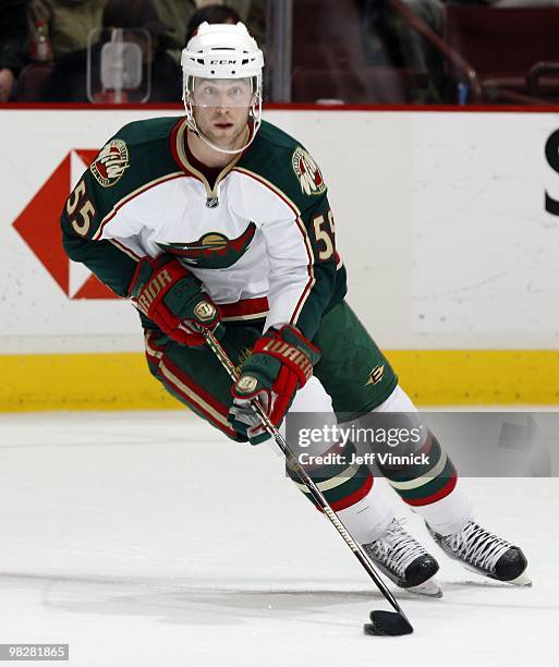 Nick Schultz of the Minnesota Wild skates up ice with the puck during their game against the Vancouver Canucks at General Motors Place on April 4,...