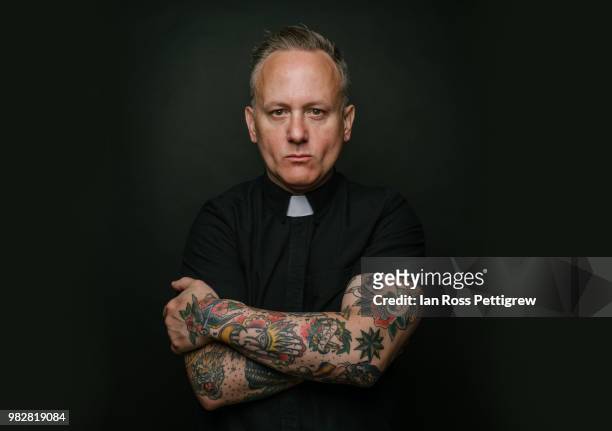 portrait of tattooed priest - priest stock pictures, royalty-free photos & images