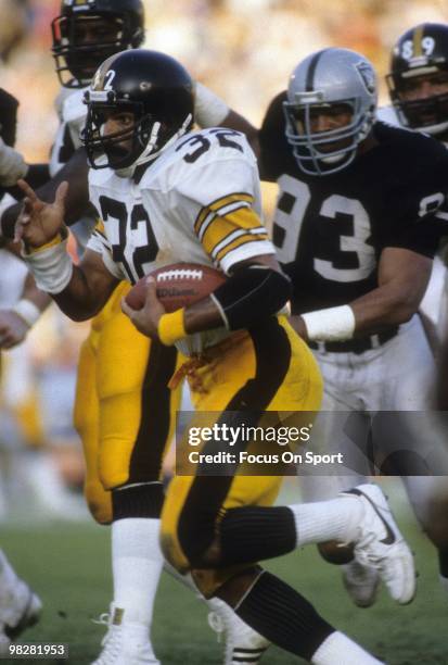 Running back Franco Harris of the Pittsburgh Steelers plays carries the ball against the Los Angeles Raiders during the AFC divisional playoff game...