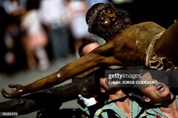 Members of the Spanish Legion carry the icon of Christ of the Good Death to the Santo Domingo de Guzman Church during an Easter procession on 1...