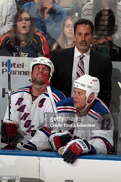 Head Coach John Tortorella of the New York Rangers along with team members Vinny Prospal and Ollie Jokinen watch the action against the Florida...