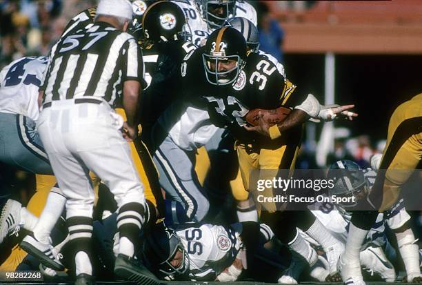 Running Back Franco Harris of the Pittsburgh Steelers plays carries the ball against the Dallas Cowboys on January 18, 1976 during Super Bowl X at...