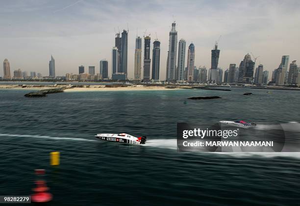 Powerboats race during the 2010 UIM X-Cat Middle East Powerboat Championship in Dubai Marina, on April 6, 2010. AFP PHOTO/MARWAN NAAMANI