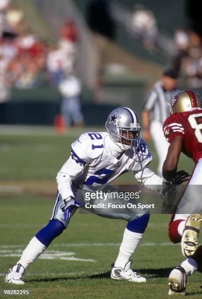Defensive back Dion Sanders of the Dallas Cowboys plays guarding wide receiver J.J. Stokes of the San Francisco 49ers November 10, 1996 during an NFL...