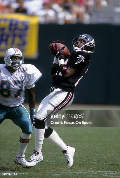 Defensive back Dion Sanders of the Atlanta Falcons plays catches a punt against the Miami Dolphins October 11, 1992 during an NFL football game at...