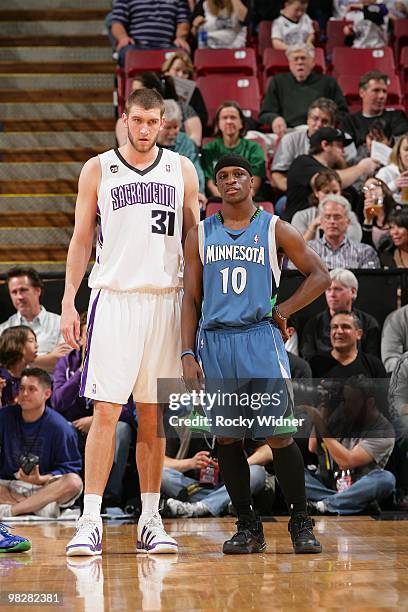 Spencer Hawes of the Sacramento Kings and Jonny Flynn of the Minnesota Timberwolves stand on the court during the game on March 14, 2010 at ARCO...