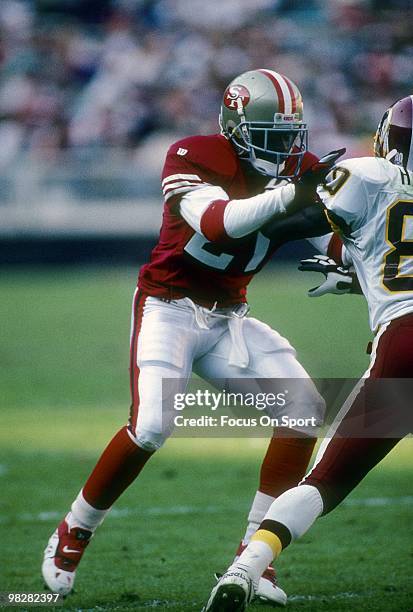 Defensive back Dion Sanders of the San Francisco 49ers plays guarding wide receiver Desmond Howard of the Washington Redskins November 6, 1994 during...