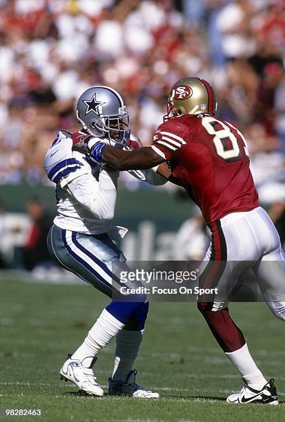 Defensive back Dion Sanders of the Dallas Cowboys plays guarding wide receiver Terrell Owens of the San Francisco 49ers November 10, 1996 during an...