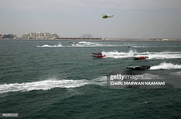 Powerboats race during the 2010 UIM XCat Middle East Powerboat Championship in Dubai Marina, on April 6, 2010. AFP PHOTO/MARWAN NAAMANI