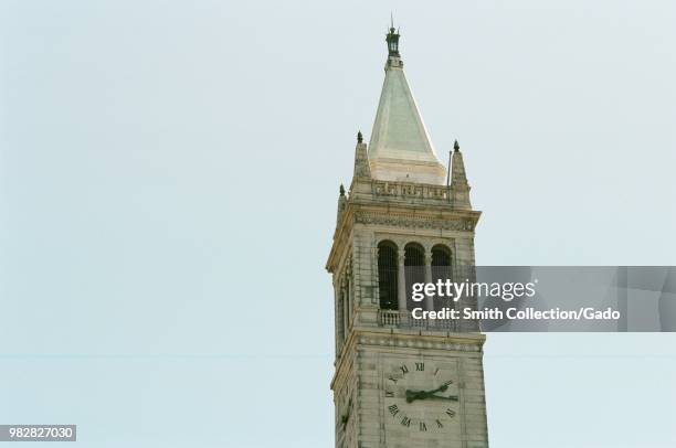 Detail view of the clocktower and campanile atop Sather Tower on the campus of UC Berkeley in Berkeley, California, with copy space to left, May 21,...