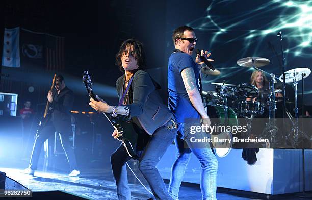 Bassist Robert DeLeo, guitartist Dean DeLeo, singer Scott Weiland and drummer Eric Kretz of Stone Temple Pilots perform at the Riviera Theatre on...