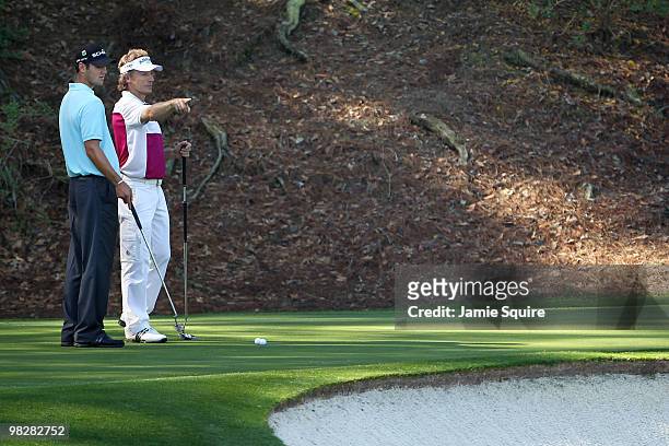 Bernhard Langer of Germany and Martin Kaymer of Germany talk during a practice round prior to the 2010 Masters Tournament at Augusta National Golf...
