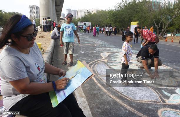 Participants of Raahgiri take part in painting, open gym, bhangra, zumba and other events at Sector 55, 56 Golf Course Road, on June 24, 2018 in...