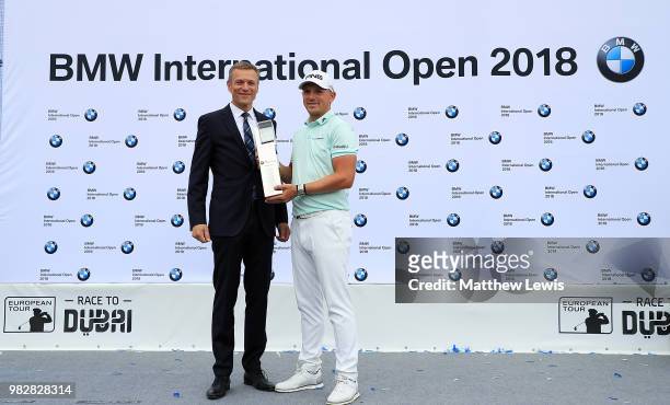Matt Wallace of England celebrates after winning the BMW International Open at Golf Club Gut Larchenhof on June 24, 2018 in Cologne, Germany.
